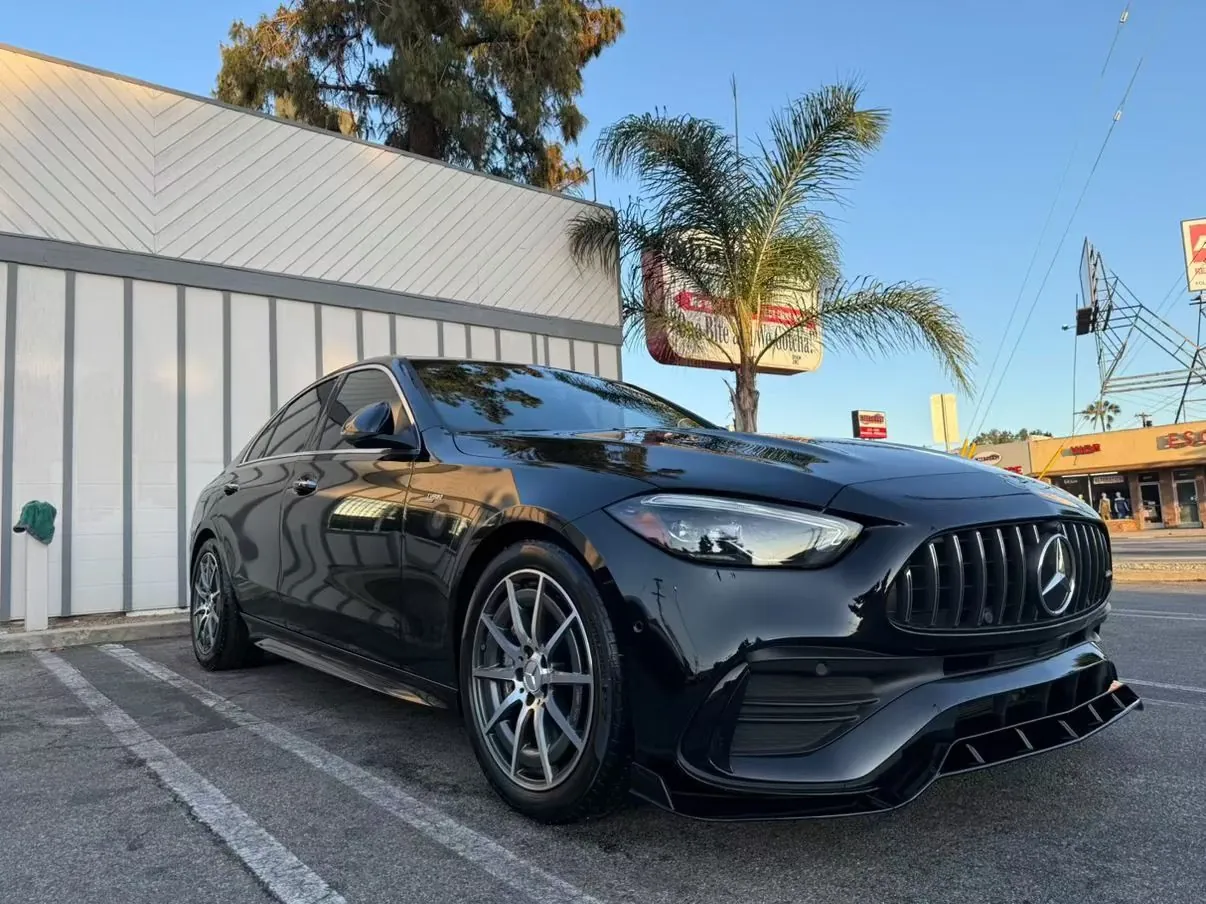 Black Mercedes-AMG C43, front three-quarter