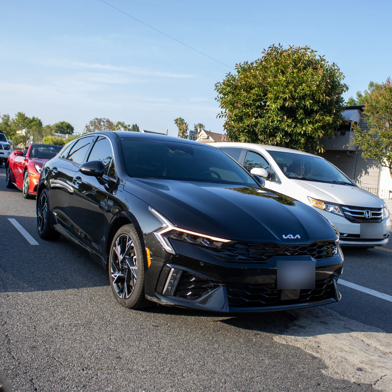 Black Kia K5, front